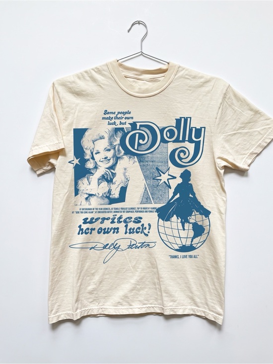 Gildan Tops - In Memory of Dolly Parton Writes Her Own Lucky Cream T-Shirt